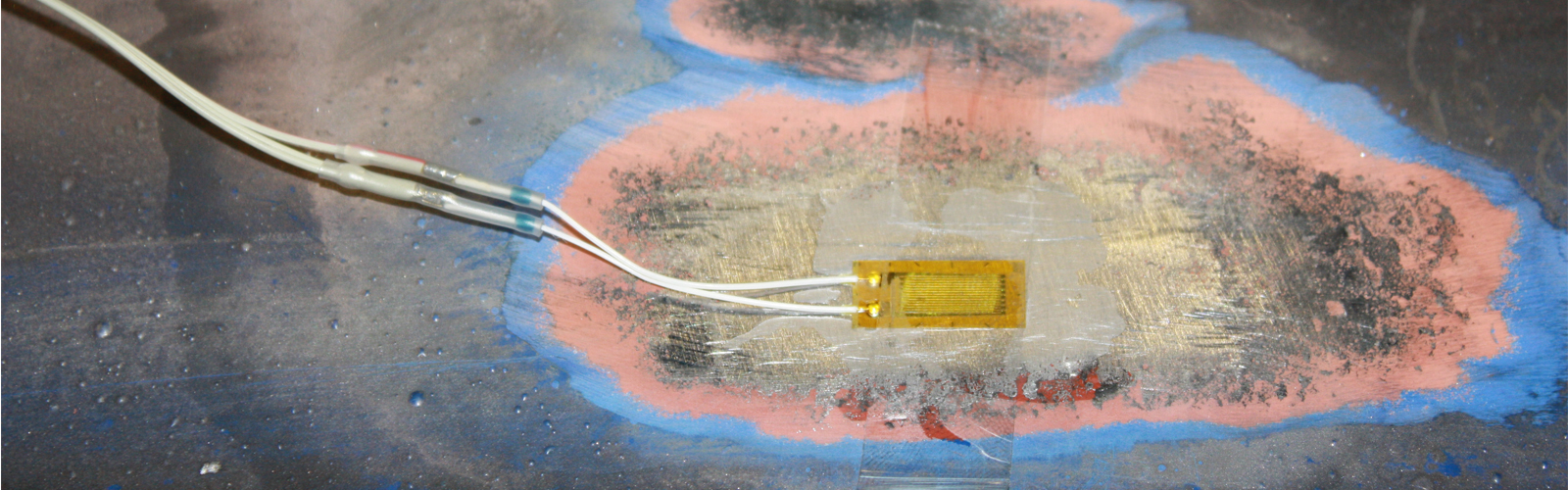 example application of strain gauge to steel beam